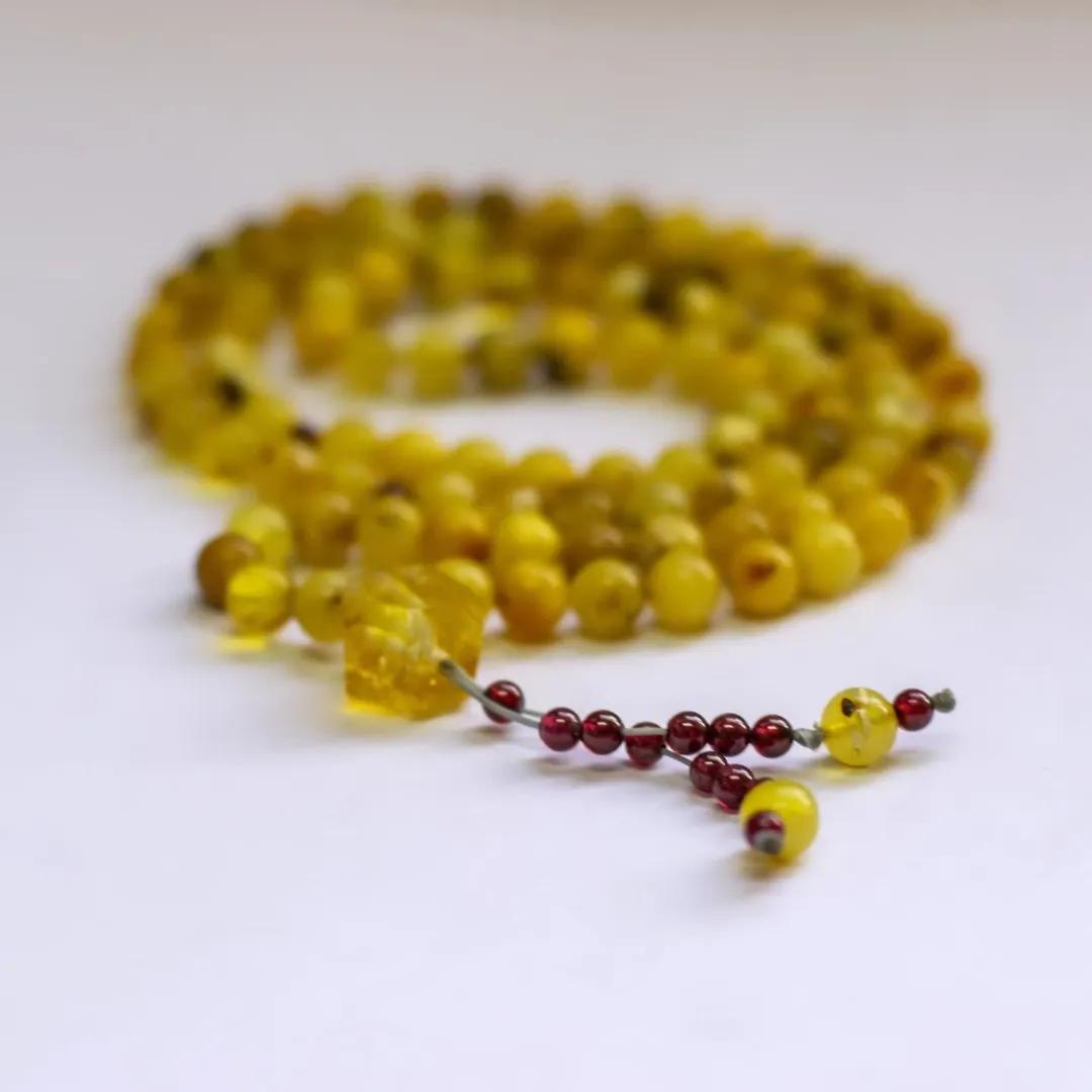 Amber Rosary – 100 Beads with Citrine center piece and Garnet counter - Aquarius Stones
