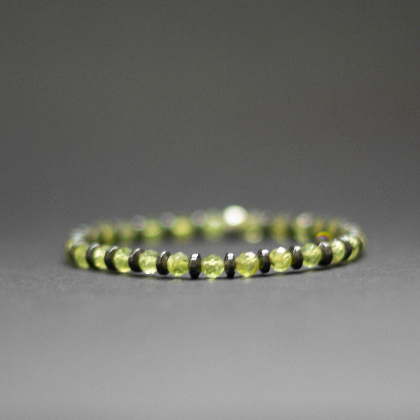 Peridot and grey Hematite Bracelet 4mm facet – Pulse Collection - Aquarius Stones