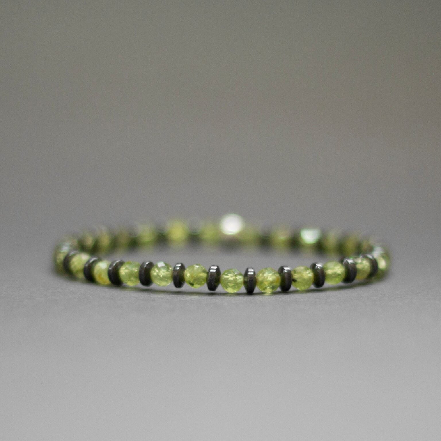 Peridot and grey Hematite Bracelet 4mm facet – Pulse Collection - Aquarius Stones