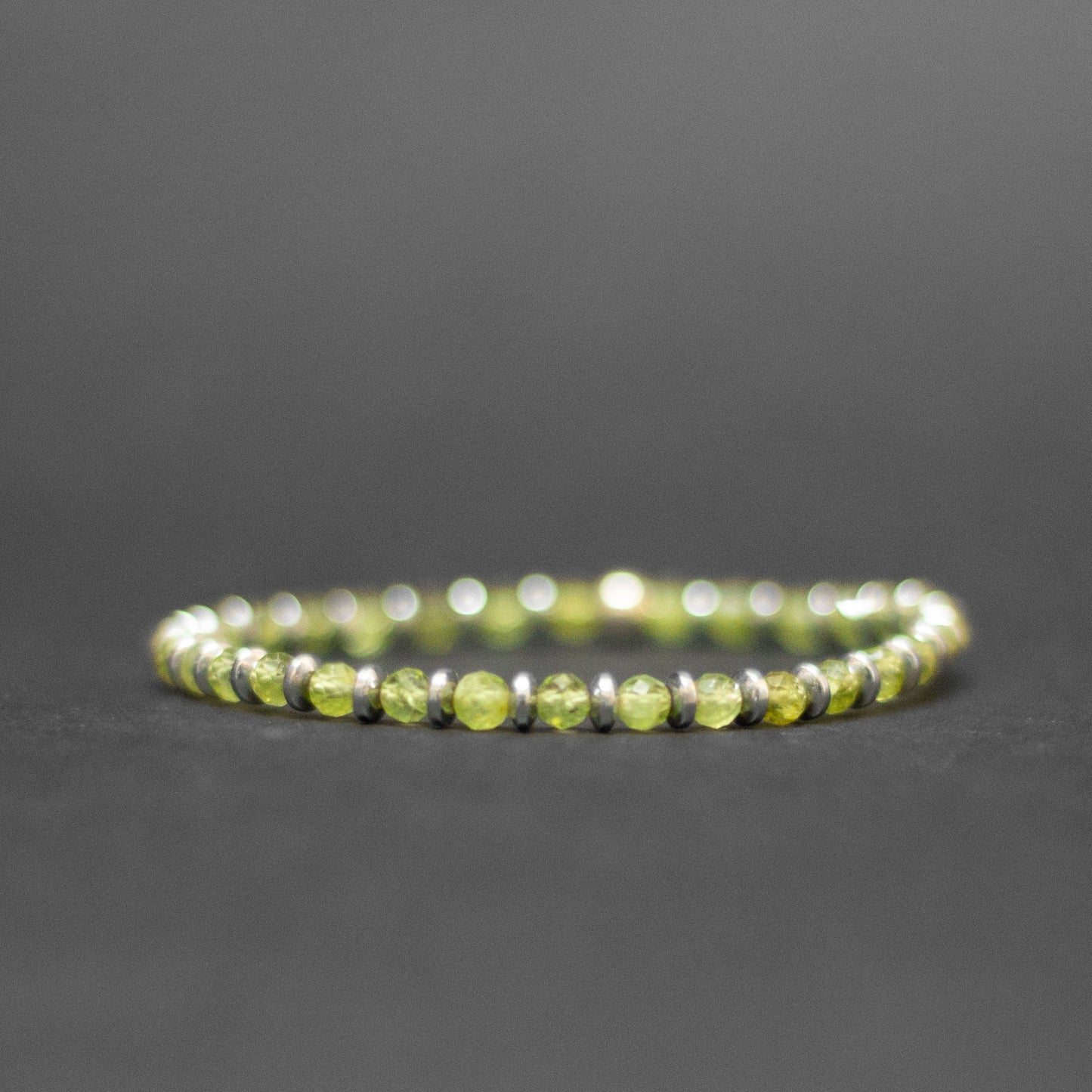 Peridot and grey Hematite Bracelet 4mm facet – Pulse Collection - Aquarius Stones